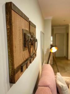 a wall with a large piece of art on a wall at Hostal Boutique Plaza Cantarero in Nerja