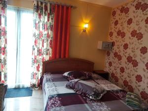 Postel nebo postele na pokoji v ubytování SkylineInn Hotel + 12 fotografií