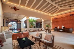 a living room with a couch and a table at Radisson Resort Phan Thiet in Phan Thiet