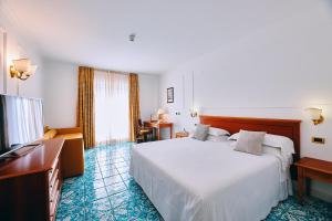 Postel nebo postele na pokoji v ubytování Oleandri Resort Paestum