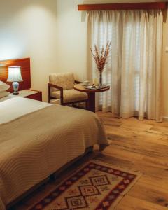 Postel nebo postele na pokoji v ubytování Kallithea INN