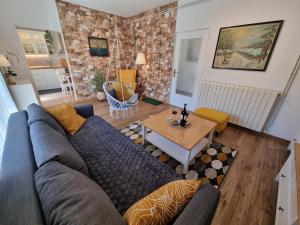 a living room with a couch and a table at Apartment ANAMARIJA BR. 1 in Crikvenica