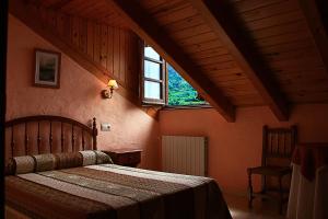 Säng eller sängar i ett rum på Hostal Casa Lacreu