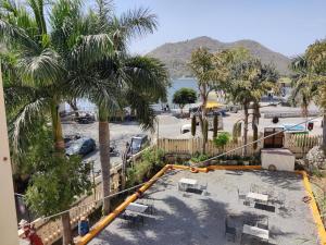a view from the balcony of a resort with palm trees at The Fateh Hotel by Le Pension Stays in Udaipur