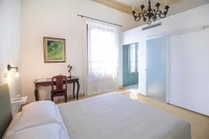 Posteľ alebo postele v izbe v ubytovaní DOMUS ALERIA Deluxe Rooms