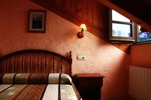 Postel nebo postele na pokoji v ubytování Hostal Casa Lacreu