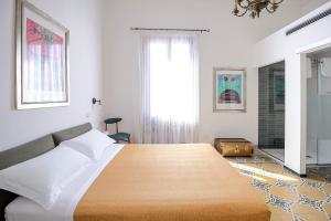 Posteľ alebo postele v izbe v ubytovaní DOMUS ALERIA Deluxe Rooms