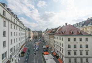 a view of a city street with buildings and cars at Pension Neuer Markt in Vienna +37 photos