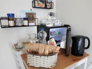 a table with a basket on top of a table at Petite Anchorage in Christchurch