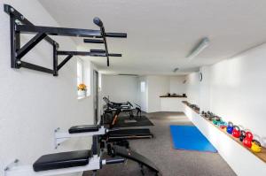 a room with several treadmills and a gym at Apartments Sandito in Mlini