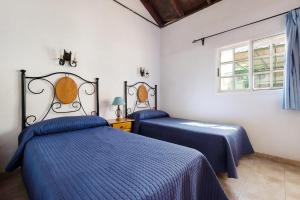 Postel nebo postele na pokoji v ubytování Casa El Cardon A2