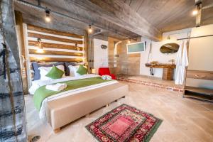 A bed or beds in a room at Ölüdeniz Loft - Adults Only