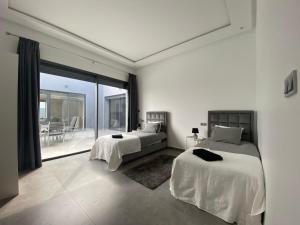 Ένα ή περισσότερα κρεβάτια σε δωμάτιο στο Villa softsun