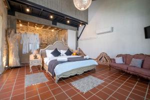 A bed or beds in a room at Ölüdeniz Loft - Adults Only