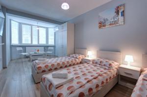 Postel nebo postele na pokoji v ubytování Daisy - 3 Room and kitchen apartment in Lazur + 4 fotografie