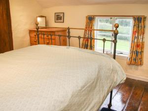 מיטה או מיטות בחדר ב-Denbigh Hall