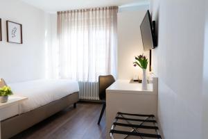 TV a/nebo společenská místnost v ubytování Hotel La Fleur