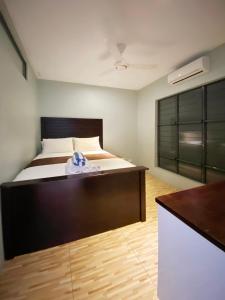 Posteľ alebo postele v izbe v ubytovaní GreyStone Apartments