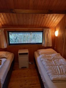 Un pat sau paturi într-o cameră la fraai chalet Barvaux