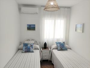 Voodi või voodid majutusasutuse Casa Rural El Duende de Tarifa toas