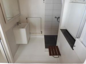 a white bathroom with a sink and a toilet at Maison de Marie in Pont-Sainte-Maxence +11 photos