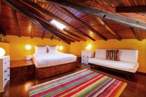 מיטה או מיטות בחדר ב-Casa do Piano