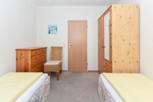 Ein Bett oder Betten in einem Zimmer der Unterkunft Ferienhaus Ingrid