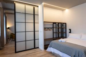 Кровать или кровати в номере PISO DE DISEÑO CON VISTAS A LA RIA.