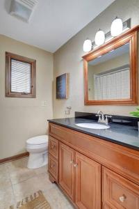 a bathroom with a sink and a toilet at Bayside Beach House in Burlington
