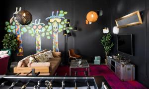 a living room filled with furniture and decorations at P182 Hidden Hostel in Berlin
