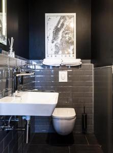 a bathroom with a sink and a toilet at P182 Hidden Hostel in Berlin