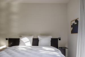 Postel nebo postele na pokoji v ubytování Hotel Nenuphar