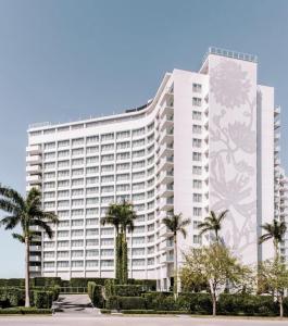 
a large building with a large clock on it at Mondrian South Beach in Miami Beach
