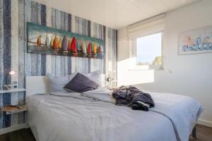 Ένα ή περισσότερα κρεβάτια σε δωμάτιο στο Ferienhaus-Marinaperle-am-Kai-29a