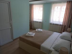 Postel nebo postele na pokoji v ubytování H.A.S.K
