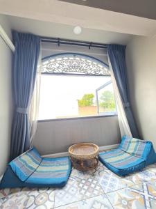 a room with a bed and a window at Sridonchai Heritage, Night Bazaar Chiang Mai in Chiang Mai
