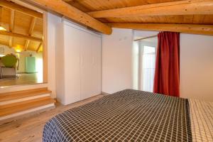 Postel nebo postele na pokoji v ubytování Casa nel Borgo - Il Gufo