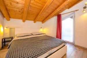 Postel nebo postele na pokoji v ubytování Casa nel Borgo - Il Gufo