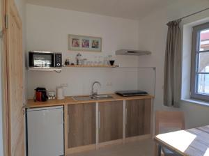 Kuchyň nebo kuchyňský kout v ubytování Ferienhaus am Himberg