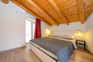 Postel nebo postele na pokoji v ubytování Casa nel Borgo - Il Gufo