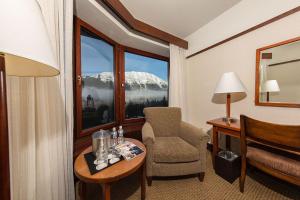 a hotel room with a view of a snow covered mountain at Alyeska Resort in Girdwood