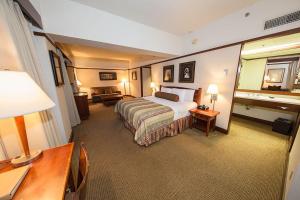 a hotel room with a bed and a desk at Alyeska Resort in Girdwood