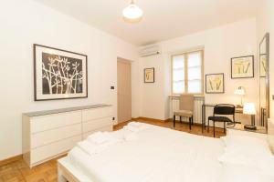 Posteľ alebo postele v izbe v ubytovaní Piazza Vittorio Veneto Central Apartment