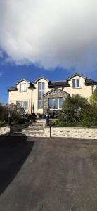 a large house with a driveway in front of it at La Cita B&B in Blarney