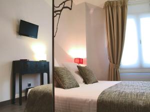 Кровать или кровати в номере Le Petit Boutique Hotel