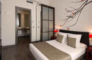 Кровать или кровати в номере Le Petit Boutique Hotel