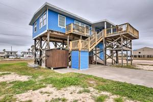 a blue house with a deck and a yard at Surfside Beach Gem with Deck - 1 Block to Shore! in Freeport