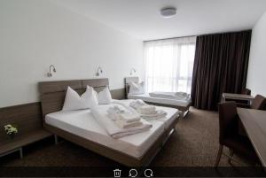 Łóżko lub łóżka w pokoju w obiekcie Lifestyle Hotel Leithana