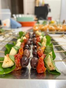 a tray of food with vegetables on a table at Bryn Noddfa in Morfa Nefyn +37 photos