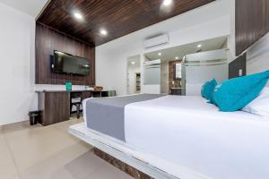Un pat sau paturi într-o cameră la Ayenda San Antonio Plaza